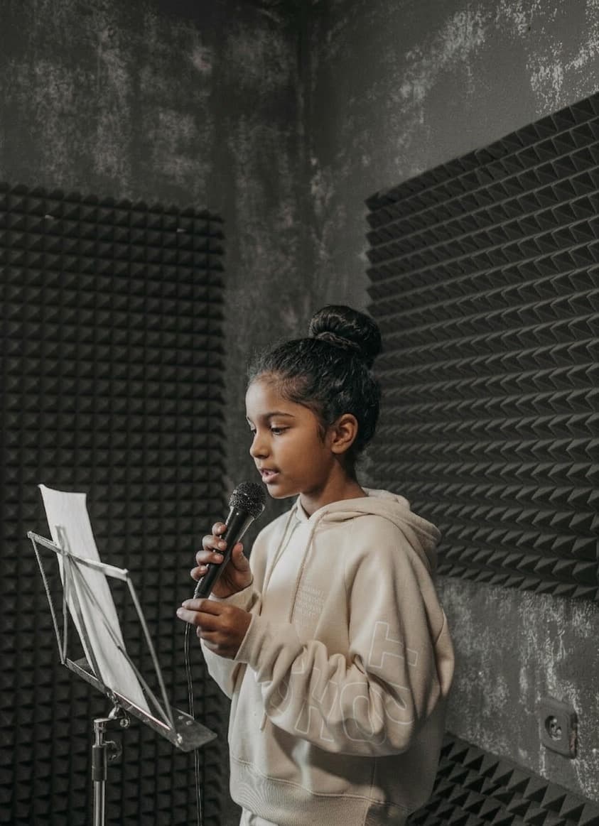 Young singer in recording studio